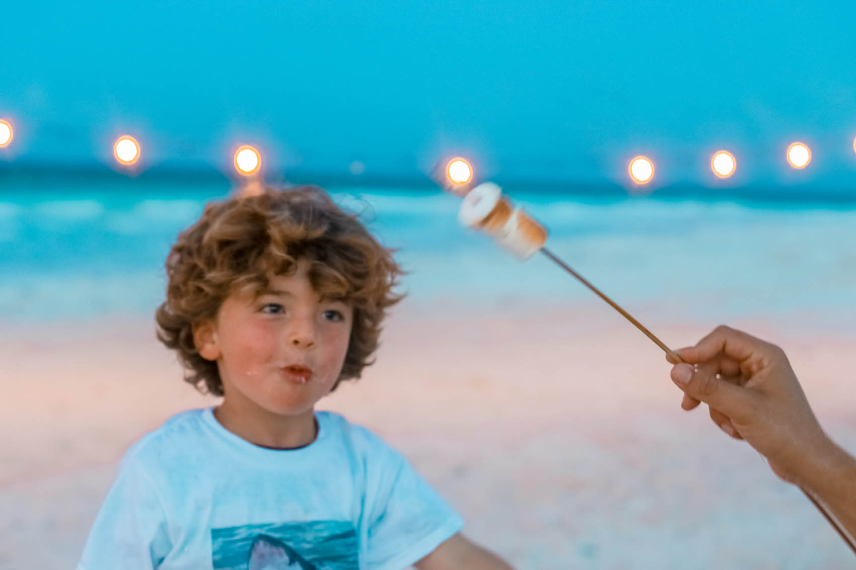 Young boy enjoying marshmallow treat